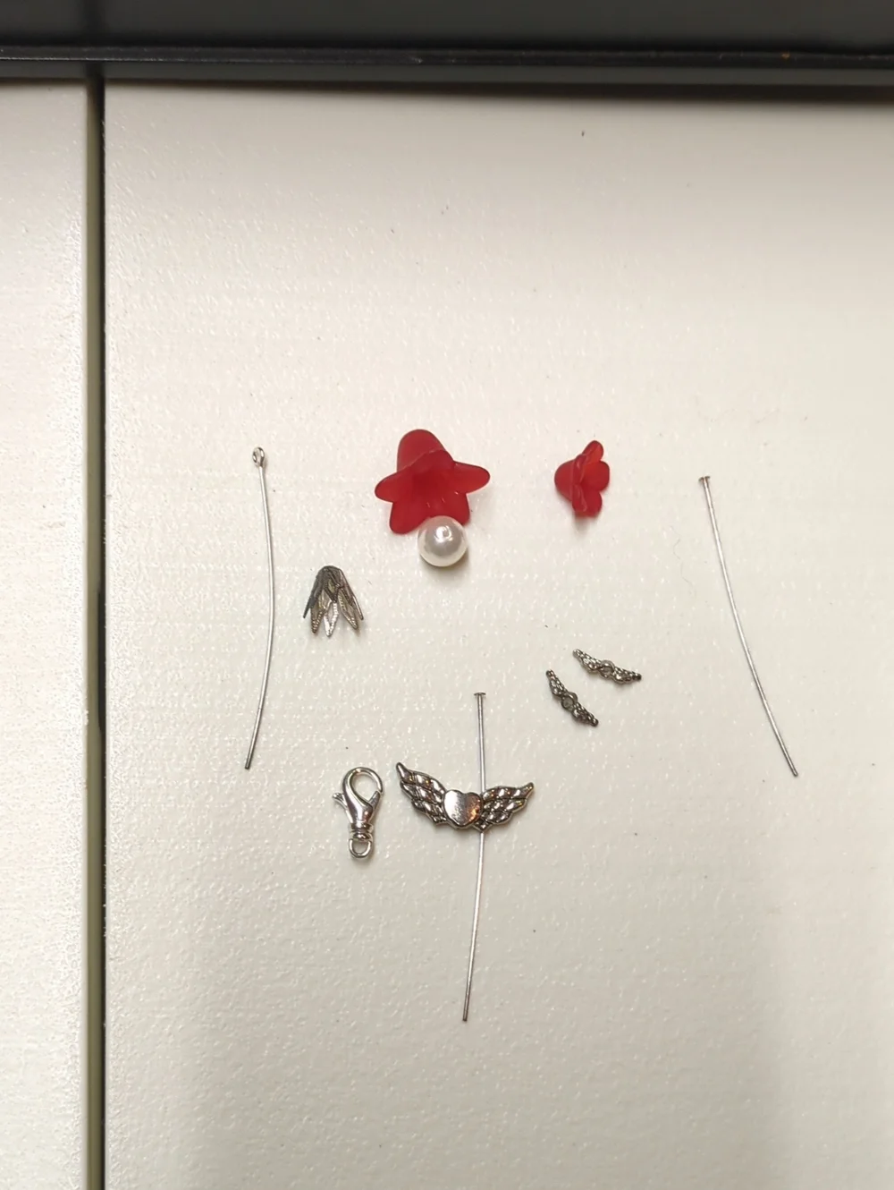 Silver Wing Charm Earring Set with Red Flower Accent